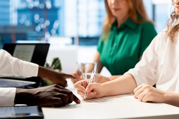 Illustration of employment support with professionals signing documents in an inclusive recruitment and professional integration context