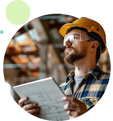 Industrial professional reviewing plans on a tablet in a production environment