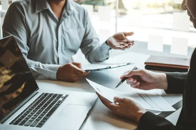 Professionals discussing skills management during a work meeting