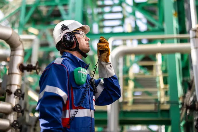Industrial technician in an energy facility illustrating practical technical training