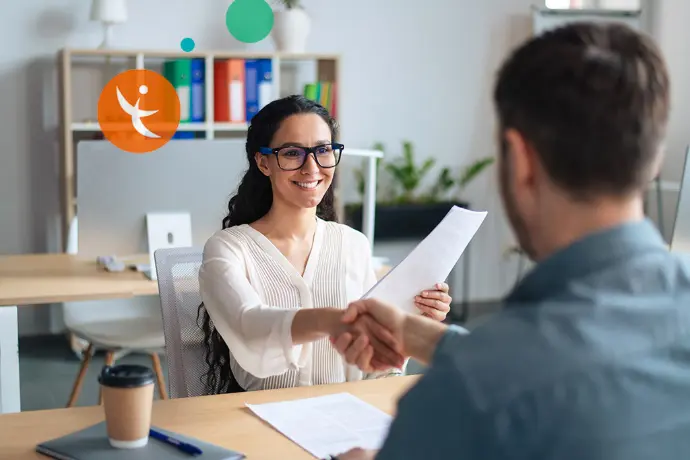 Illustration of a professional interview with a handshake between two people as part of AGEFIPH support and professional integration assistance