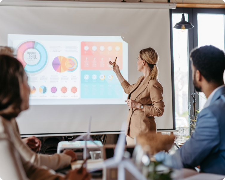 Trainer presenting data during a professional training session in a classroom